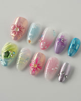 Gem Blossom nails in extra short almond — pastel mix design chrome