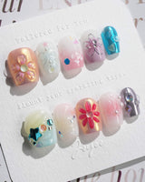 Gem Blossom nails in extra short coffin — pastel mix design chrome