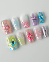 Gem Blossom press-on nails in short coffin shape — pastel mix design chrome iridescent flower pearl butterfly 3D accents