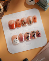 Ghostlight press-on nails in extra short coffin shape — Playful Halloween, Pumpkin & Ghost Glitters.