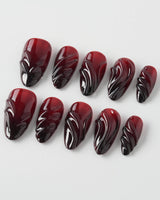 Ghoul Glam press-on nails in short almond shape — Dark Red & Black, 3D Liquid Flow.
