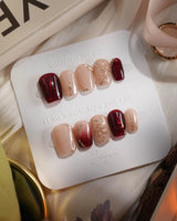 Gilded Rouge in extra short coffin shape with amber burgundy polish and gold leaf detail