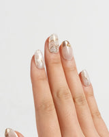 Gilded Truth press-on nails in short oval shape — Minimalist Aurora White, Gold Metallic Outlines & Heart Illustrations.