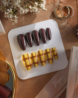 Ginger Plaid press-ons with chocolate brown nails, plaid accents, and warm autumn styling