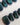 Glint Aurora press-on nail set — deep teal cat eye shimmer design, hand-painted with real gel polish