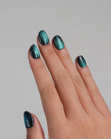 Glint Aurora handmade press-on nails featuring deep teal cat eye shimmer