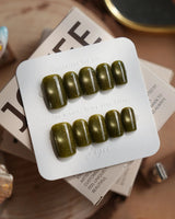 Glint Olive press-on nails in short coffin shape — olive green cat eye shimmer