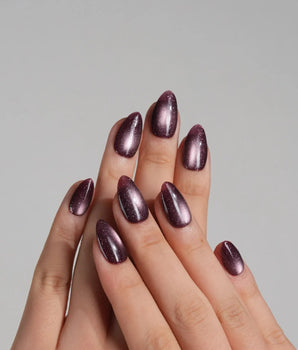 Glint Plum handmade press-on nails featuring deep plum cat eye shimmer