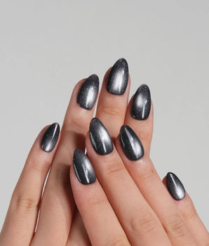 Glint Tahiti handmade press-on nails featuring gunmetal cat eye shimmer