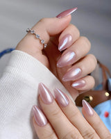 Glow Pop close-up of rose pink cat-eye gel with mirror-like chrome surface