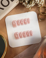 Glow Pop short almond press-ons with pearl nude pink tone and mirror chrome glow