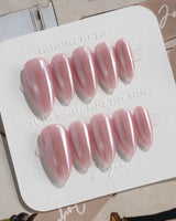 Glow Pop handmade rose pink nails with reflective chrome and luminous cat-eye polish