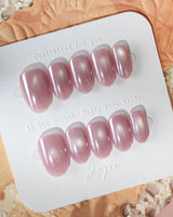 Glow Pop summer nails with glowing pink nude base and mirrored chrome finish