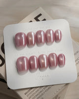 Glow Pop extra short coffin nails with rose pink cat-eye and chrome reflection