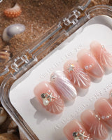 Glow Shore nude pink press-on nails with 3D shells, starfish and pearls