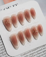 Glowing Blush press-on nails — Transparent Blush Cat Eye, Simple Silver Bow Outline. handmade nail art by Joyee Nails