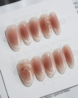 Glowing Blush press-on nails — Transparent Blush Cat Eye, Simple Silver Bow Outline. handmade nail art by Joyee Nails