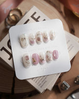 Golden Hour press-on nails in extra short oval shape — Romantic Dusty Pink Gradient, 3D Metallic Roses & Silver Ribbon.