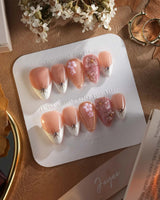 Golden Tide gold French tip floral press-on nails in short stiletto shape