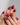 Close-up of Gone with the Wind press-on nails with marbled burgundy and gold foil details