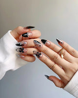 Gorgeous Gown nail art close-up showing black white gradient rhinestone bow y2k nails details