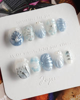 Great Barrier Blue close-up of metallic shell carvings and high-shine pearl accents