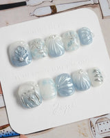 Great Barrier Blue extra short squoval nails with pearly shells and silver-blue shine