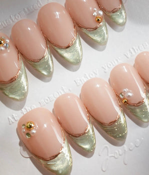 Silk Green - New handmade press-on nails featuring nude pink base sage green french gold outline pearl studs cat eye effect