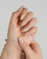 Tweed Light nails with warm gold glitter, yellow tweed plaid, and delicate trim details