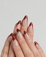 Bow French press-on nail set — nude base red chrome french gold outline bow accent design, hand-painted with real gel polish