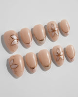 Haze Bloom press-on nails — Elegant Nude Pink, Embossed Florals & French Gold Edging. handmade nail art by Joyee Nails