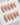 Elegant press-on nails with nude base and gold petal inlay