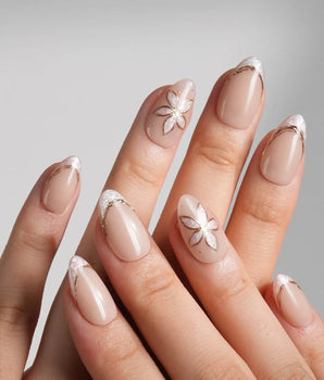 Haze Bloom handmade press-on nails featuring Elegant Nude Pink, Embossed Florals & French Gold Edging.