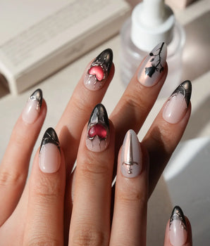 Heartbreaker press on nails with a 3D chrome snake, dagger, red heart in liquid silver and black rose silhouettes on nude with black tips - image 1