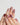 Holiday press-on nails with hand-painted bows and candy stripes