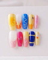 Candy Pop Colored press-on nails in medium coffin shape — gradient multicolor abstract gloss nails