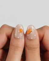 Juicy Summer handmade orange nail art on cool blue and warm nude bases