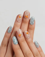 Juicy Summer glossy fruit nails with hand-painted tangerines and bubble-like dots