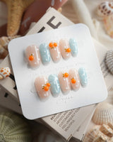 Juicy Summer orange citrus press-on nails in short coffin shape