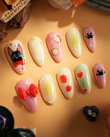 Kiki’s Enchanted Picnic handmade press-on nails featuring Pastel Multicolor, Hand-painted Cat & Bow.
