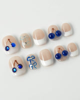 Klein Blue Cherry extra short squoval nails with blue cherry French tip design