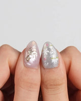 Koi Dream press-on nails in extra short almond shape — Shimmering Mermaid Pearl, Metallic Relief Goldfish & cat eye effict.
