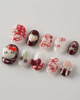 KT Cake press-on nails in extra short oval with cute dessert details and glossy finish