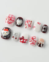 KT Cake press-on nails in extra short squoval with cake-inspired art and soft shine