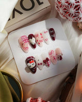KT Cake press-on nails in XS medium almond with sweet dessert-inspired 3D nail art