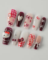 KT Cake press-on nails in medium coffin with glossy dessert-inspired nail art