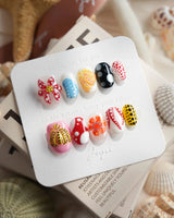 Kusama Dot extra short oval press-on nails with bold museum-inspired dot art