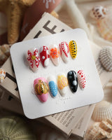 Kusama Dot short almond press-on nails with pop-art polka dots and glossy gel