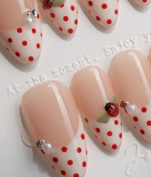 Ladybug Picnic handmade press-on nails featuring Vintage Red Polka Dots, Hand-painted Ladybugs & French Pearl Accents.