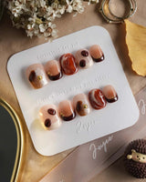 Latte Coffee press-on nails with coffee bean accents, milk foam swirls and glossy brown marble